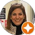 Portrait of a smiling woman with an orange Google Local Guide badge overlay.