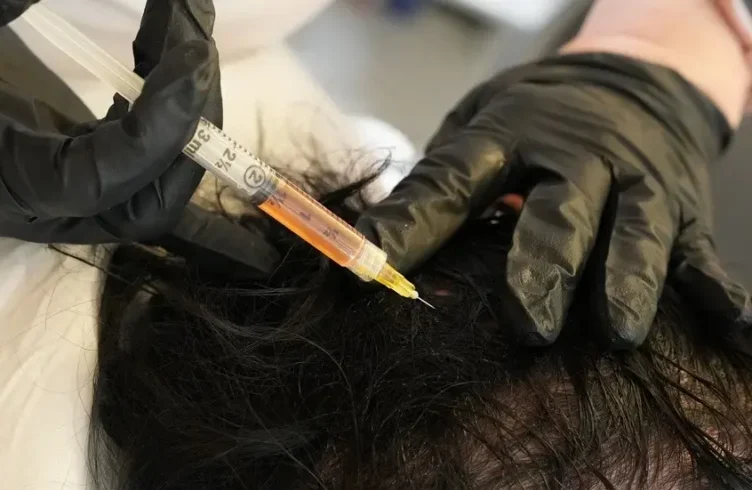 Ethical and Transparent Aesthetic Care — Elegance Cosmetic Clinic Aesthetic provider demonstrating devices and treatment methods during consultation