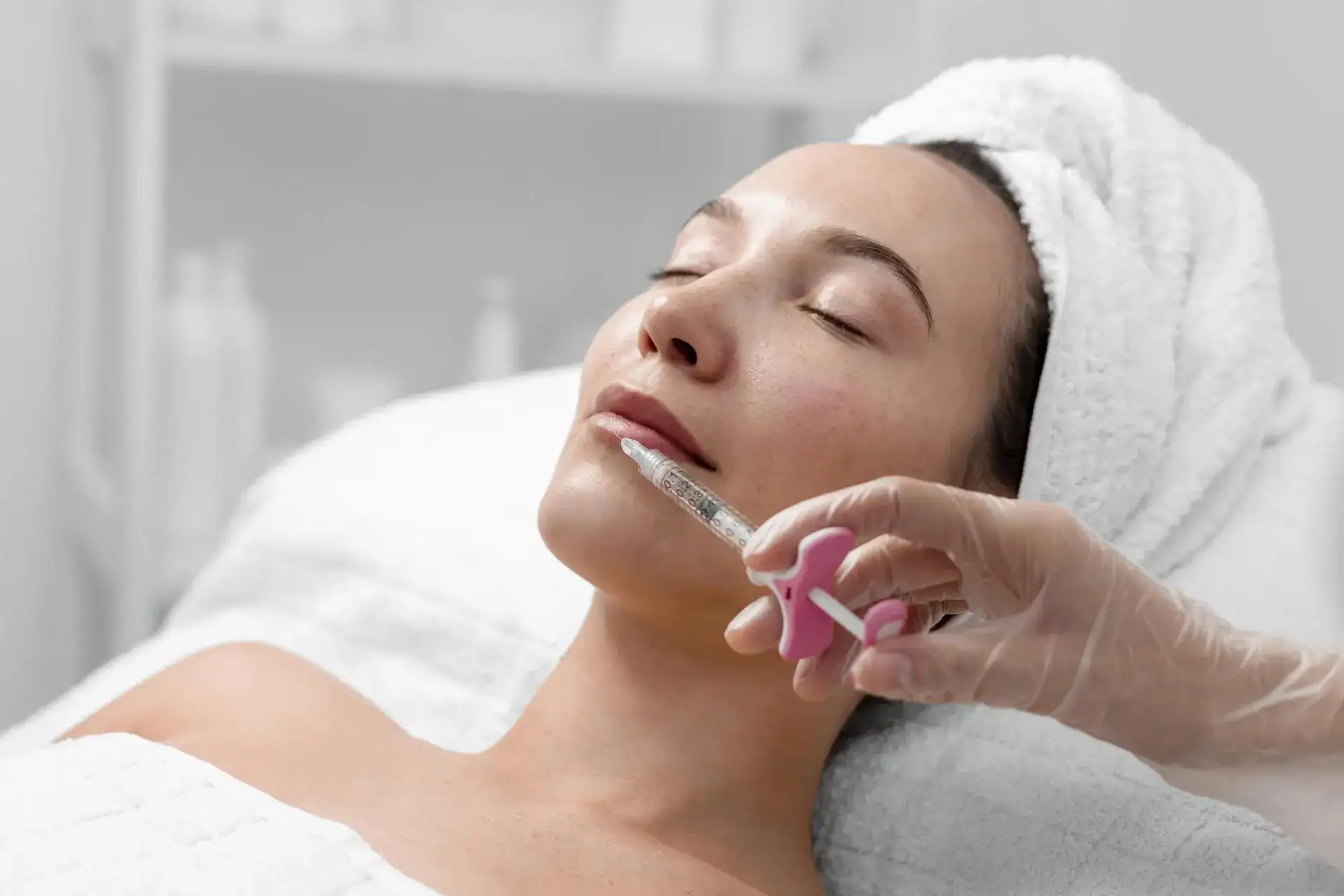 Woman with smooth, radiant skin receiving a mesotherapy treatment